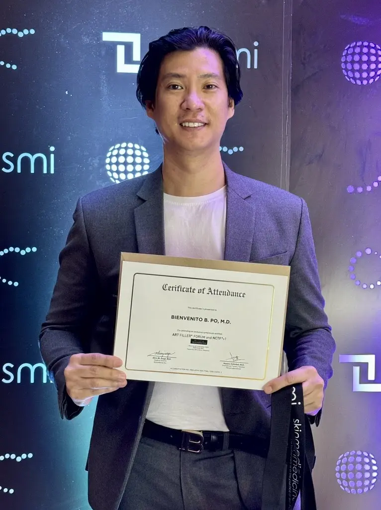 Dr. Bien Po holding his certificate at the NCTF professional launch