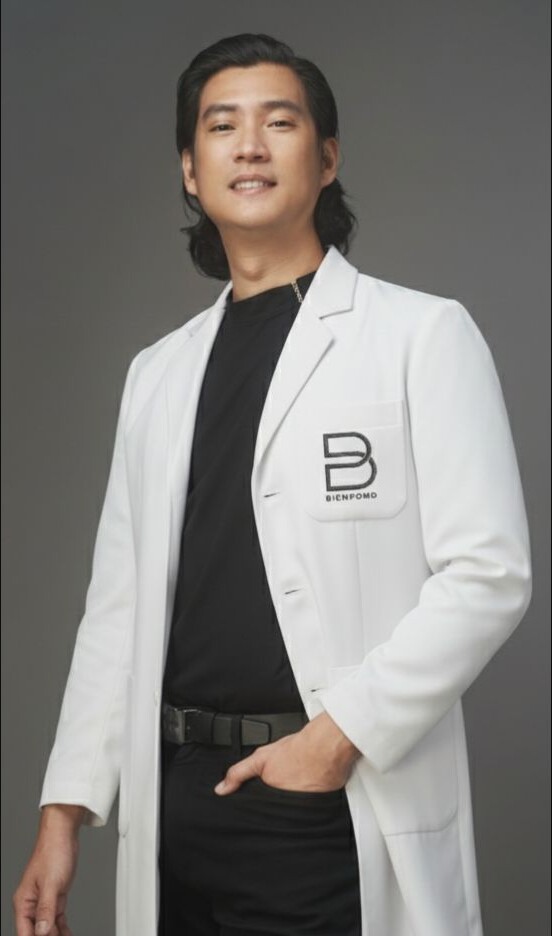 Dr. Bien Po in his BienPoMD clinic coat